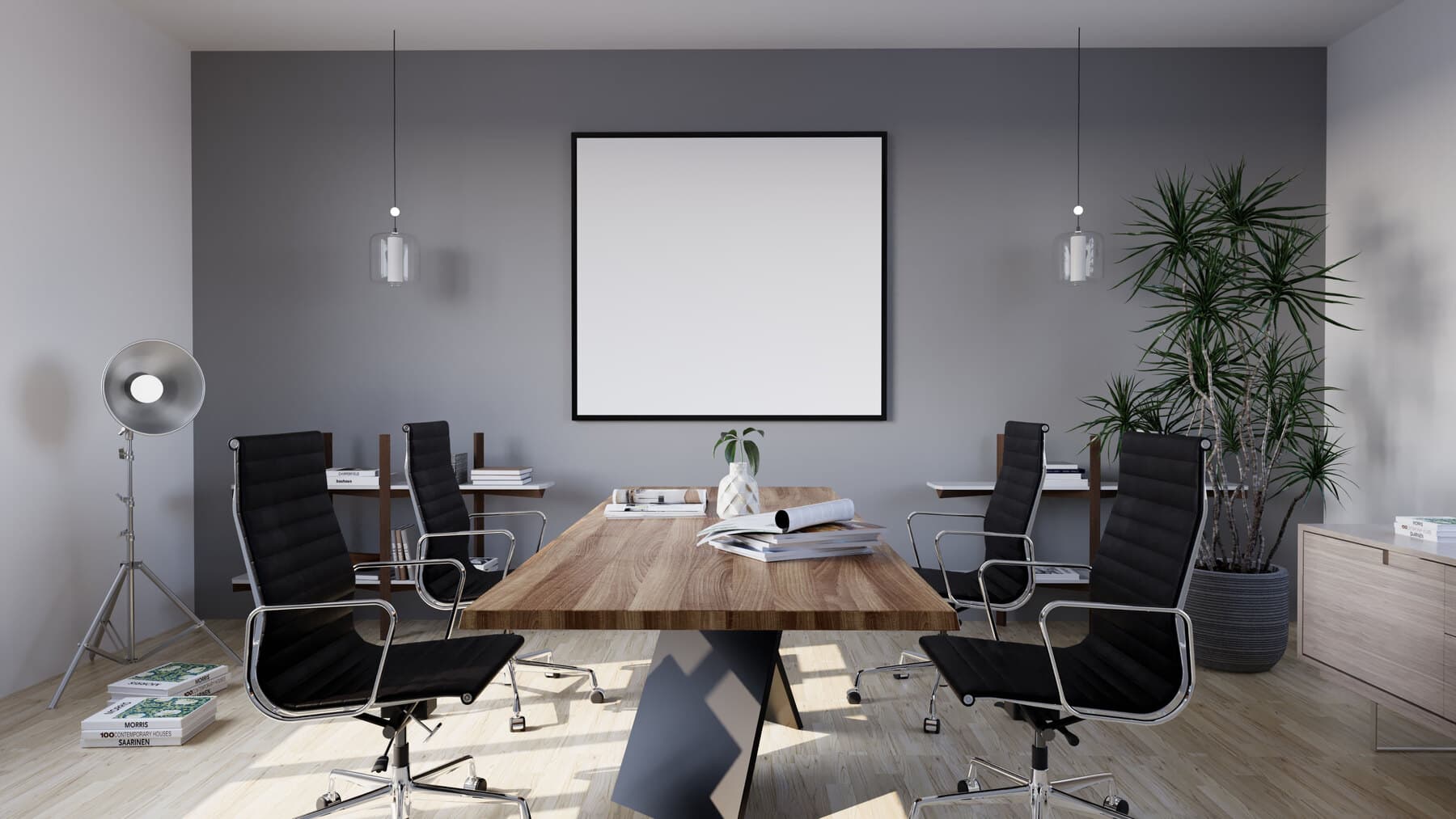 Meeting room with a long table and black chairs